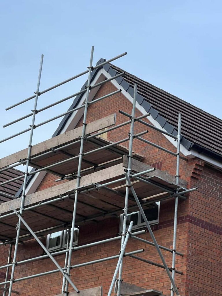This is a photo of a roof which has just been repaired. There is a scaffold located at the gable end for access onto the roof. Works carried out by Hassocks Roofing Repairs